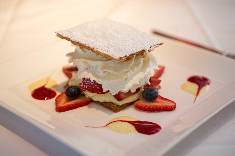 Puff pastry dessert with custard and fresh strawberries